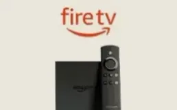Amazon Fire TV Stick beside its remote